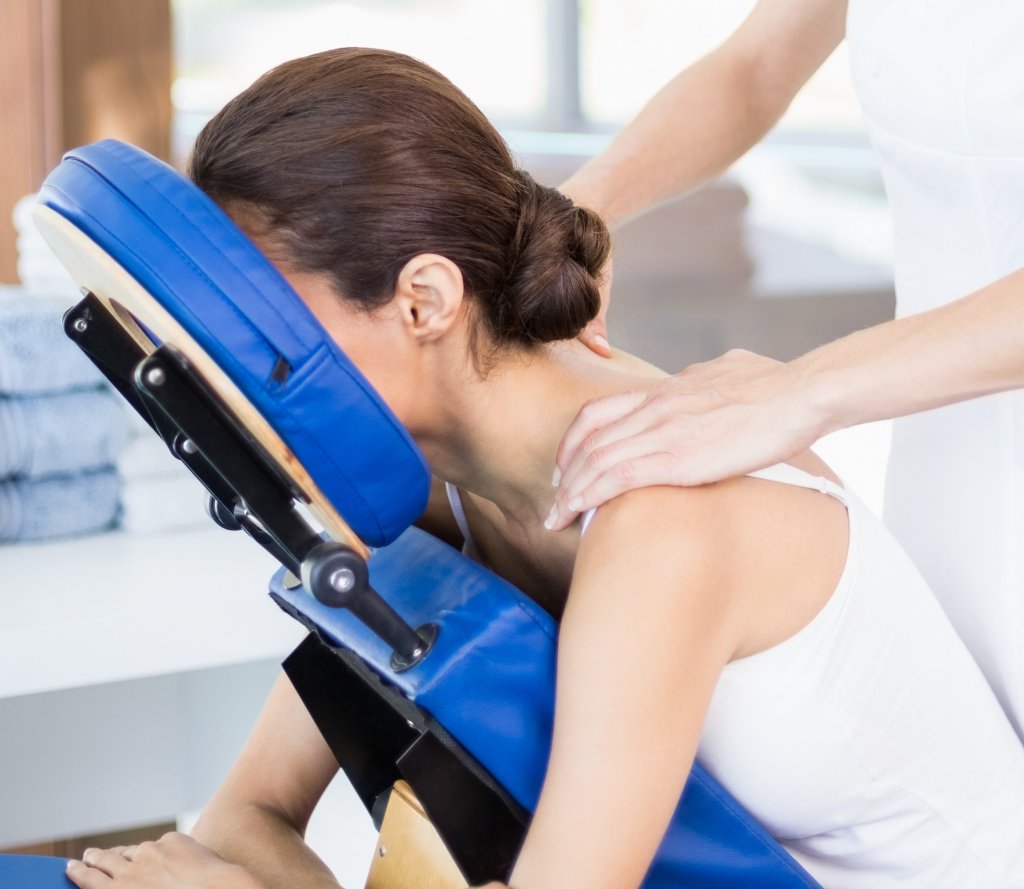 Young Woman Receiving Shoulder Massage On Site Massage Co